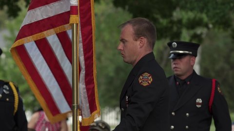 Madison, Wisconsin USA September,11 2021. Fireman and Police Officers holding flags during 911 ceremony.
