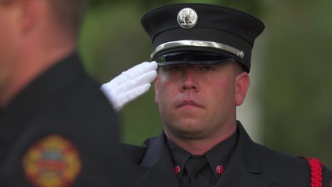 Madison, Wisconsin USA September,11 2021. Fireman saluting during 911 ceremony.