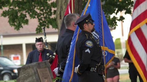 Madison, Wisconsin USA September,11 2021. Firemen and Police Officer stand at attention during 911 ceremony.