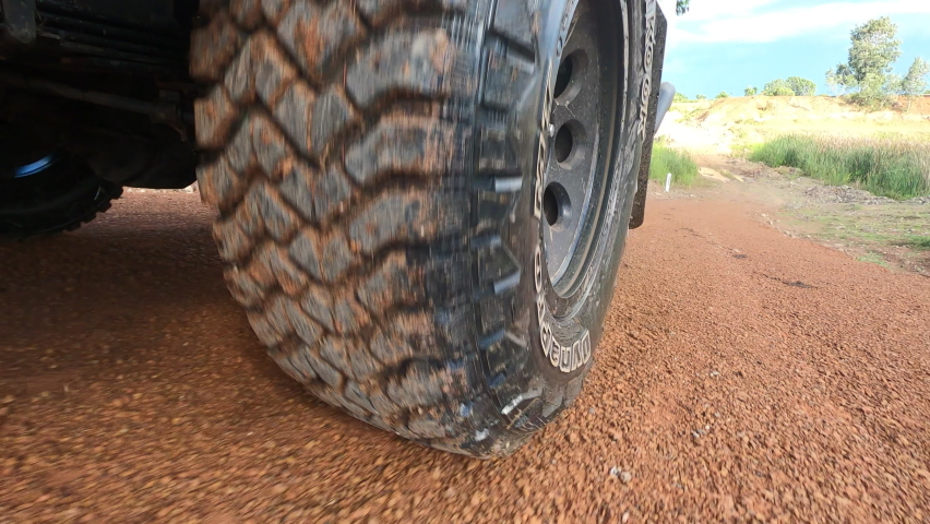 Point of view rear wheel of the light truck 4wd all wheel drive pickup running on a dirty ground off-road, adventure travel with 4x4 off road concept Royalty-Free Stock Footage #1080612674