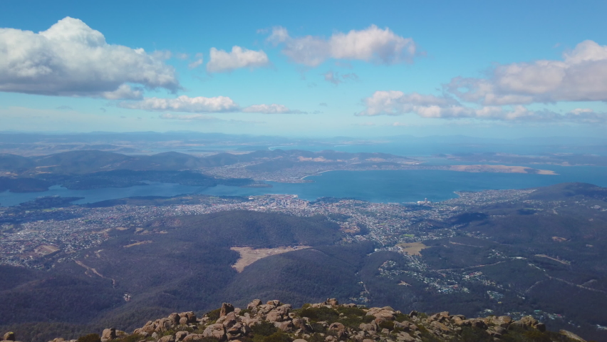 Locked off motion view of the city of Hobart on a sunny day from the lookout at the top of Mount Wellington,Hobart, Tasmania, Australia