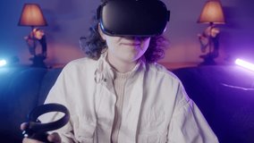 The young girl is playing games with vr technology and trying to win very focused