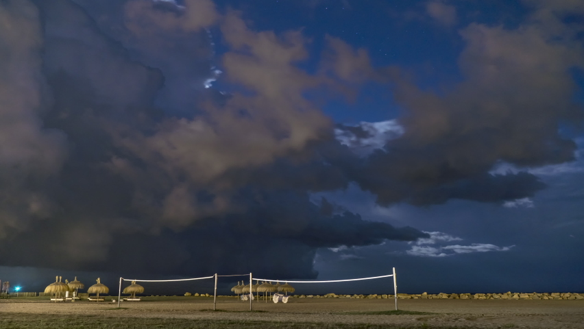Time Lapse of Electric Storm on Beach above Volleyball Court