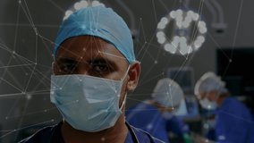 Animation of network of connections over surgeon in operating theater. medical and healthcare technology concept digitally generated video.