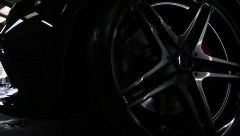 United Kingdom, Manchester October 2021.The Front Diamond Cut Alloy Wheel With centre Locks On A 2017 Metallic Black Mercedes Benz C63s AMG With Orange Red Brake Callipers