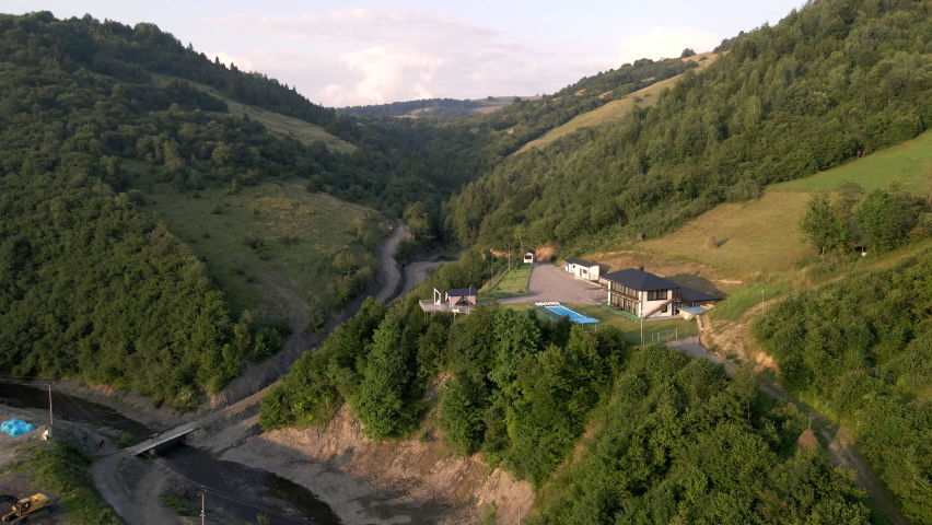 aerial view of building at mountain cliff at sunset time copy space