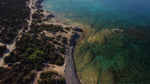 Aerial drone view of the rocky coast and the Mediterranean Sea near the scenic Aphrodite Trail in the Akamas Peninsula National Park, Cyprus. Famous tourist travel destination near Polis city, Cyprus