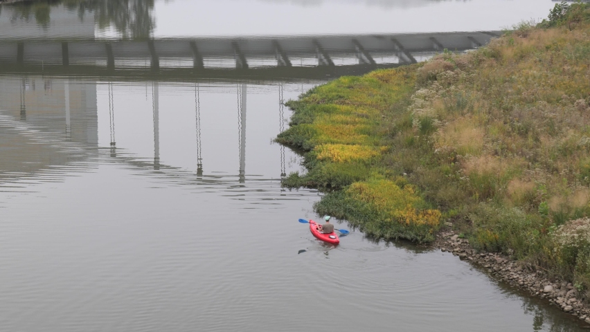 Kayaking in downtown Columbus, Ohio on the Scioto River on a misty day.