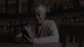 Animation of qr code over woman using smartphone. global digital security and identity, digital interface and data processing concept digitally generated video. - Powered by Shutterstock - Get 15% off with code: PIKWIZARD15