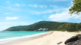 Nai harn beach Phuket,Thailand. Beautiful sea rock mountains blue sky background. Landscape view beach sea and sand in summer. Waves smooth splashing soft waters. Beach island video 4K.