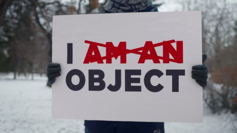 Activist With A Poster I Am Not An Object Advocating To Respect Women. Respect Women Poster Against Sexual Objectification. Poster Demonstrating Respect To Women Rights. Freedom. Society. Feminism
