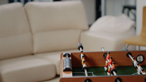 Close up of soccer game on foosball table to have fun with play after work at office. Football toy with players and ball to score goal to celebrate party with drinks after hours with colleagues