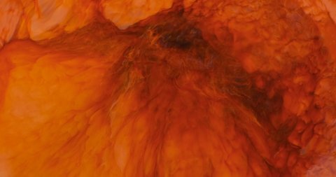 Epic red paint abstract moving close-up. Fiery red lava of paint mix together. Concept of passion flame, orange motion element. Solar energy colors patterns. Orange watercolor 4k footage background