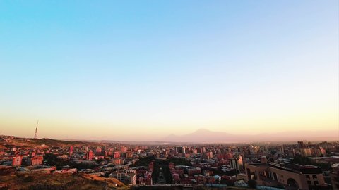 Panoramic wide Yerevan city center views from cascade complex on sunset in summer