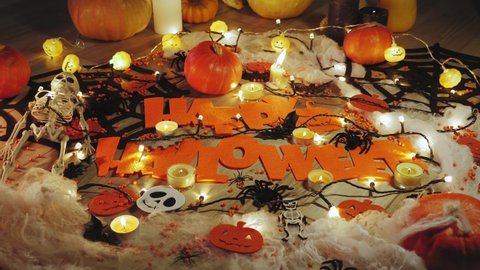 Halloween decorations and burning candles. Halloween symbols, scary pumpkin faces. Traditional autumn holiday decorations. Happy halloween