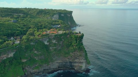 Uluwatu Temple or Pura Luhur Uluwatu is regarded as one of the six most important temples in Bali, Indonesia. 4K Aerial UHD Video clip.