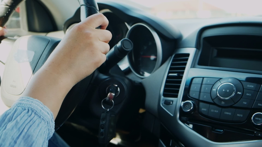 Woman hand control radio or music in car in motion | Shutterstock HD Video #1080703688