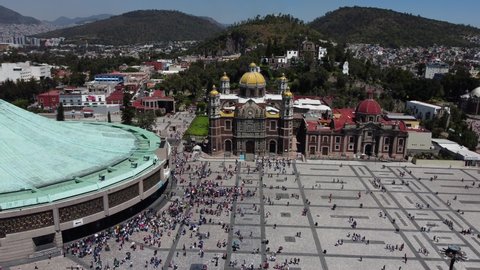 Mexico City, Mexico - October 10, 2021: Aerial view of the sacred Basilica Virgin of Guadalupe with a lot of visitors during a sunny weekend.