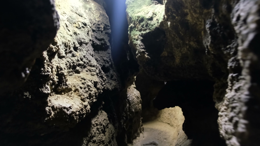 Speleology natural cave dark tunnel excavation underground. Salt production in rocks Royalty-Free Stock Footage #1080708740