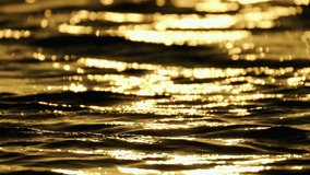 Reflection of sunlight over sea surface in slow motion. sunset on the surface of the sea. 4K video. 1.