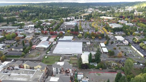 Cinematic 4K aerial drone footage of Valley Industrial and downtown, commercial area, Town Center of Woodinville, an upscale, affluent Seattle neighborhood near Bothell in King County, Washington