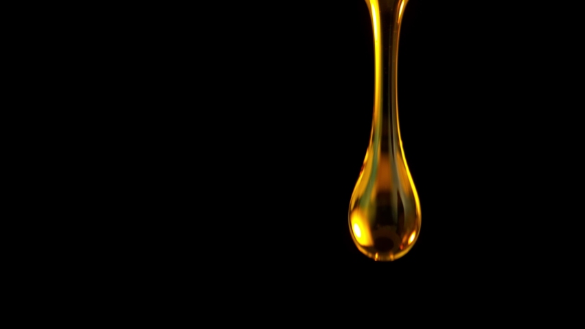 Super Slow Motion Shot of Falling Golden Droplets Isolated on Black Background at 1000 fps. | Shutterstock HD Video #1080742766