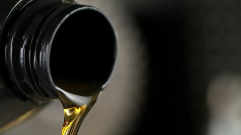 Super Slow Motion of Pouring Fresh New Motor Oil into Car's Engine. Filmed on High Speed Cinema Camera at 1000 fps.