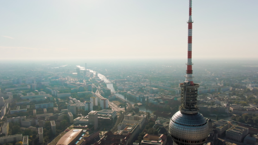 Aerial View of Berlin Cityscape with Landmark - TV Tower Fernsehturm. Famous Alexanderplatz in Capital of Germany, EU. Scenic Panorama of Berliner Skyline with Landmarks. 4K establishing drone shot