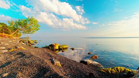 Scenic sunny beach panorama timelapse of Sevan lake. Popular holiday destination in Armenia. 4k high-quality footage