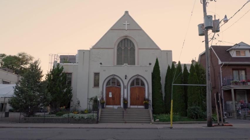 Vehicles pass by a church in East York, Toronto.