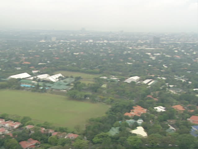 A panning panoramic cityscape shot overlooking Manila, Philippines