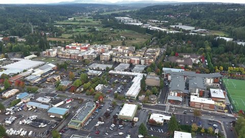 Cinematic 4K aerial drone orbiting clip of Valley Industrial and downtown, Town Center of Woodinville, an upscale, affluent Seattle neighborhood near Bothell in King County, Washington