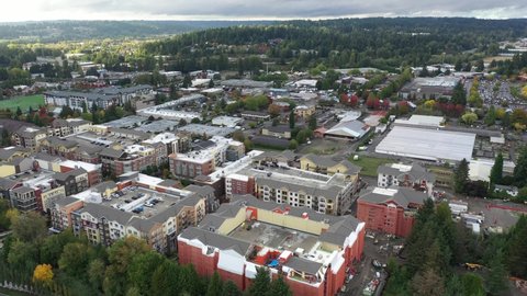 Cinematic 4K aerial drone pan shot of Valley Industrial and downtown, Town Center of Woodinville, an upscale, affluent Seattle neighborhood near Bothell in King County, Washington