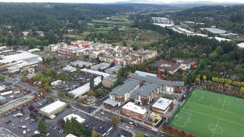 Cinematic 4K aerial orbiting drone footage of Valley Industrial and downtown, Town Center of Woodinville, an upscale, affluent Seattle neighborhood near Bothell in King County, Washington