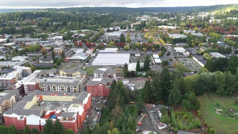 Cinematic 4K aerial dolly drone footage of commercial and residential areas of downtown, Town Center of Woodinville, an upscale, affluent Seattle neighborhood near Bothell in King County, Washington