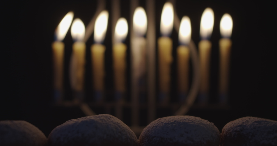 close up of Hanukkah Doughnuts being sprinkled with powdered sugar in slow motion Royalty-Free Stock Footage #1080765260