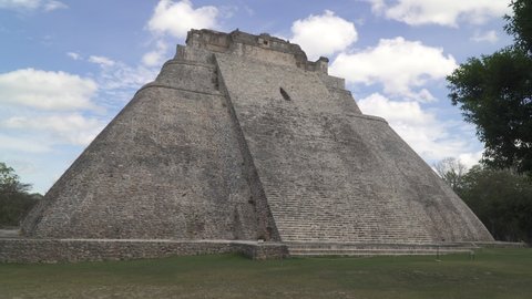 UXMAL, YUCATAN, MEXICO - CIRCA 2021: Piramide del adivino also known as the Pyramid of the Magician the central landmark of Uxmal, an ancient Mayan city in Yucatan peninsula