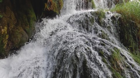 Slow motion footage of a beautiful waterfall, concept of purity and life