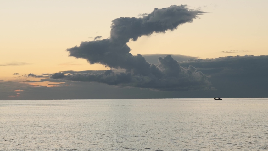 A beautiful sunset on the black sea on a cloudy day