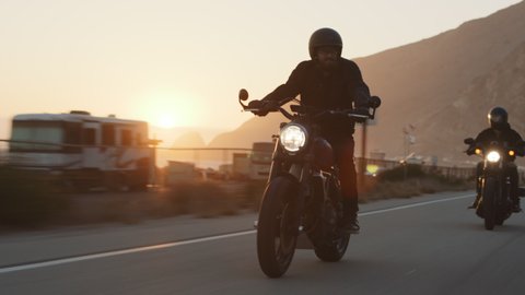 Bikers riding motorcycles at pacific coast highway in Malibu, California