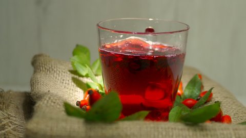 Healing red tea from rosehip berries, herbal infusion homeopathy. Red rosehip drink