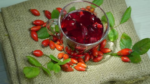 Rosehip red tea, homeopathic drink for human health. The red berry is medicinal