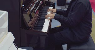 hobbies and leisure. unrecognizable man playing the piano.