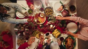 Best friends celebrating new year. International young people holding sparklers, sitting at dining table. Diverse students during christmas party at home, drinking champagne and laughing. - Powered by Shutterstock - Get 15% off with code: PIKWIZARD15