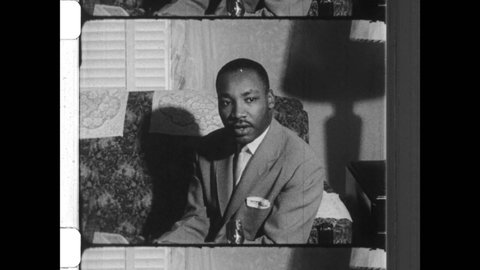 1955 Montgomery, AL.  Martin Luther King Jr address reporters about The Montgomery Bus Boycott and Rosa Parks. View of downtown Montgomery Alabama. 4K Overscan of Vintage Archival 16mm Film Print