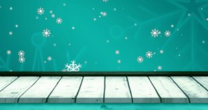 Animation of falling snowflakes and stars on blue and background wooden floor. christmas, tradition and celebration concept digitally generated video.
