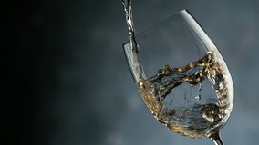 White Wine Pouring Into Glass In Detail. Super Slow Motion, Ramp Speed Effect. Filmed On High Speed Cinema Camera, 1000fps. - Powered by Shutterstock - Get 15% off with code: PIKWIZARD15