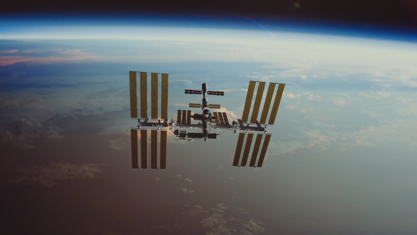 International Space Station ISS flying over earth atmosphere.