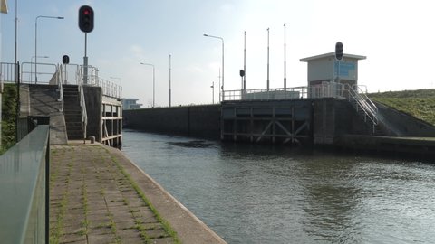 Weir and locks in Amerongen the Netherlands, sluice door closes