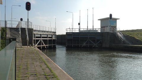 Weir and locks in Amerongen the Netherlands, sluice door closes